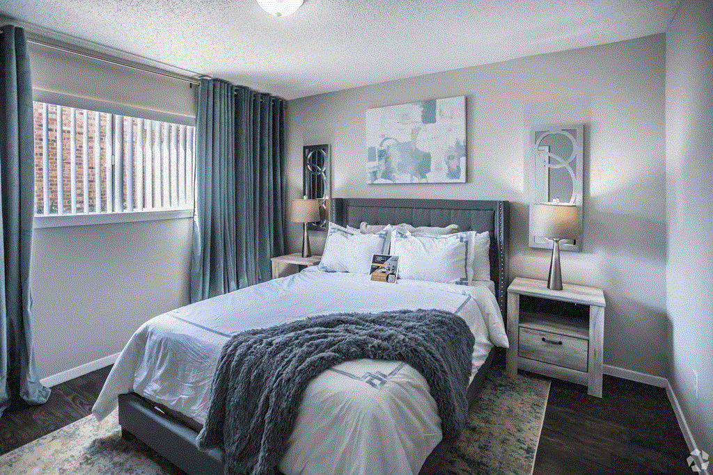 a bedroom with a bed and a window at Azure Place Apartments, Tennessee