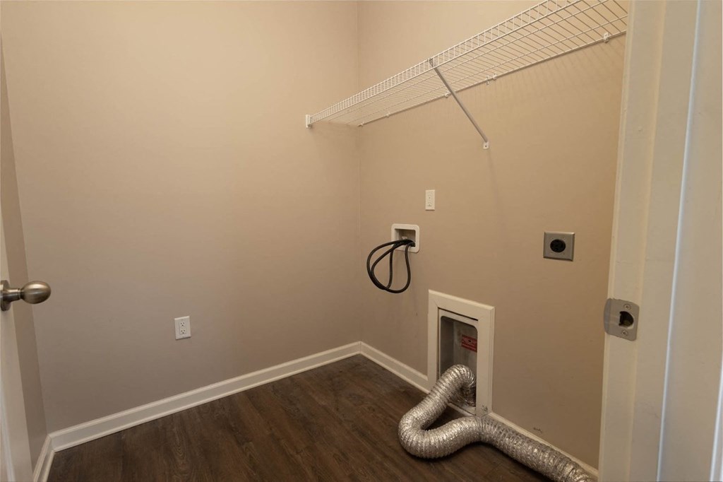 a room with a heater and a metal snake on the floor