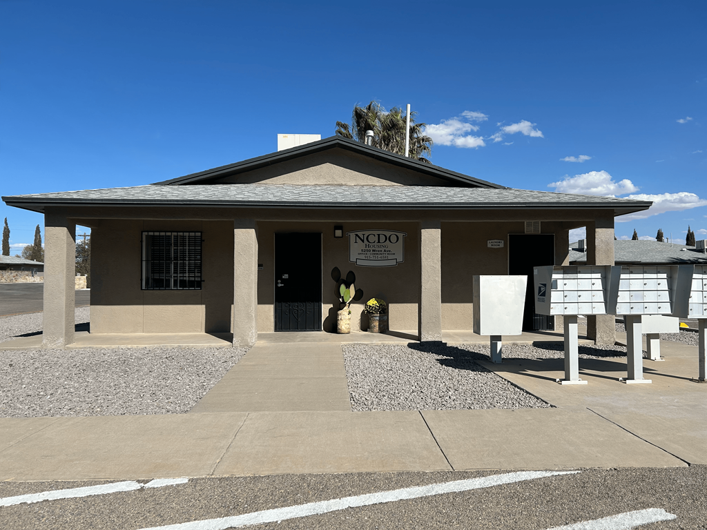 a small building with a sign in front of it
