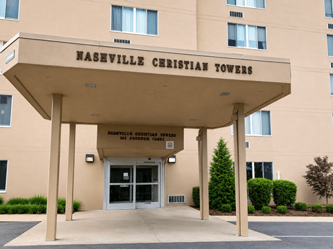 The front of the Naseville Christian Towers building is shown.