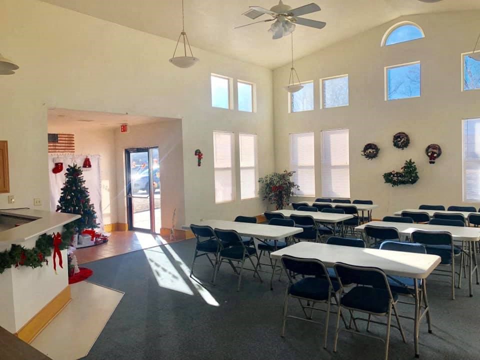 the dining hall at christmas with tables and chairs