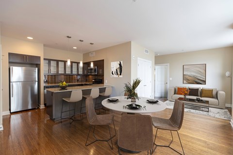 a kitchen and dining room with a table and chairs at Metro67, Memphis, TN