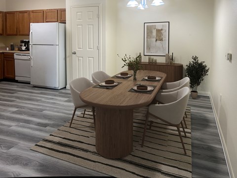 A modern dining room with a wooden table and chairs.