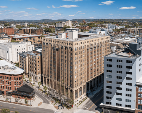 A cityscape with a large building in the center.