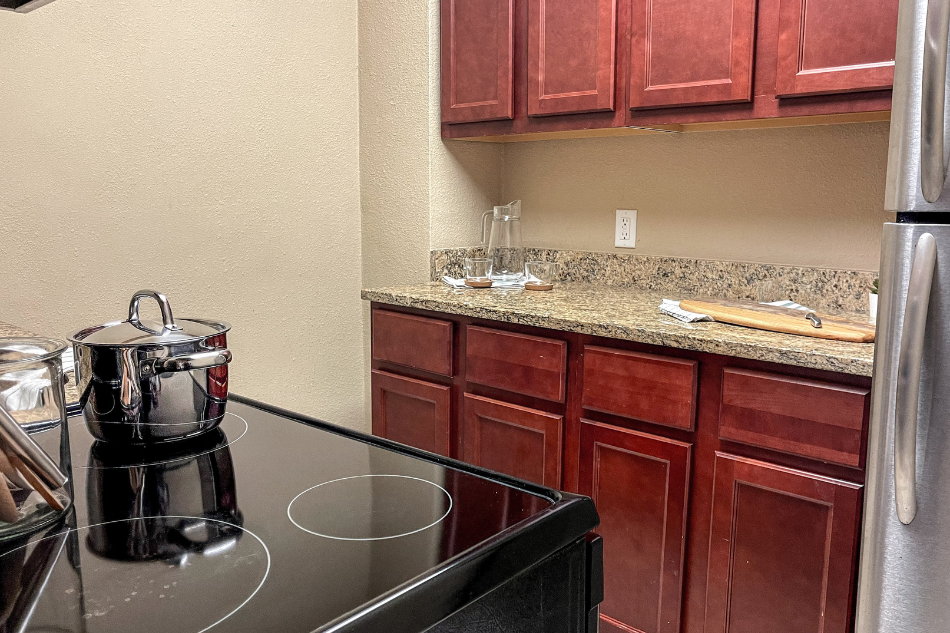 a kitchen with a counter top and a refrigerator
