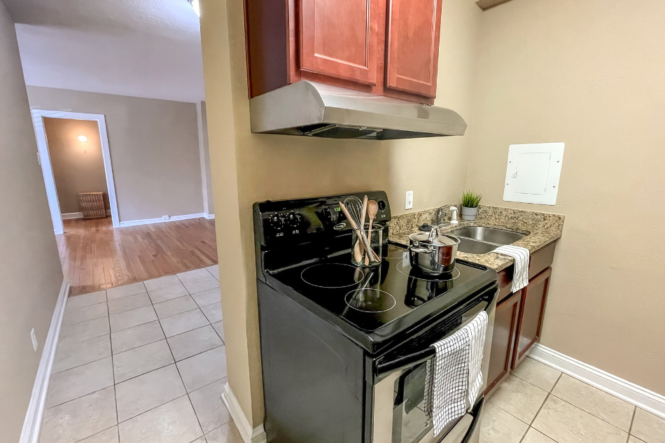 a kitchen with a stove and a sink