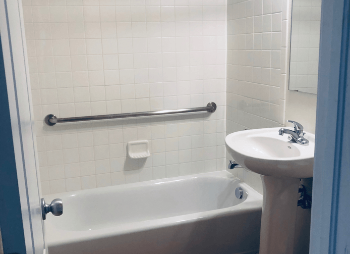 a bathroom with a sink and a bath tub