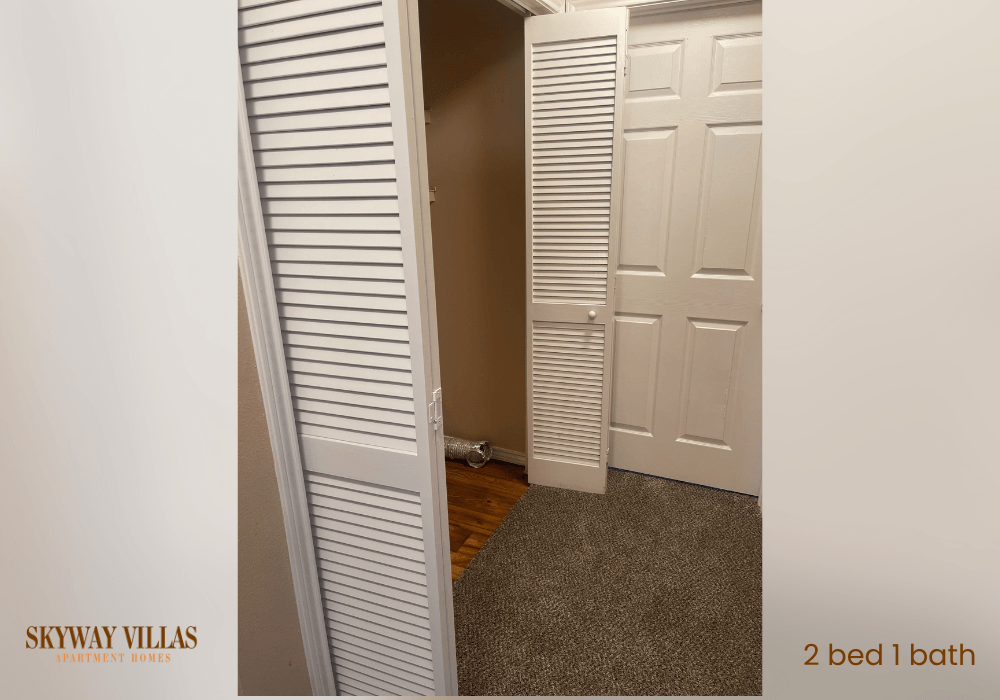 a closet with two doors and a door to a room with a door open