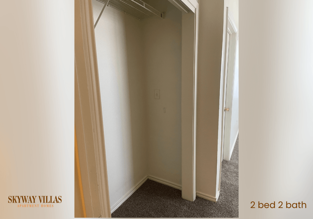 a room with a closet and a door to a bathroom