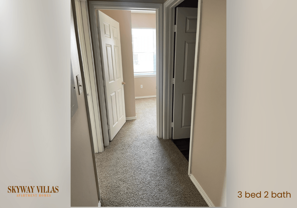 a bedroom with a door open to a hallway with a closet