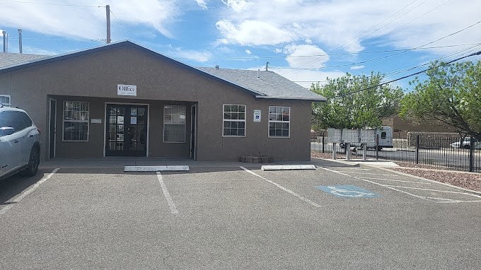 an empty parking lot in front of a building