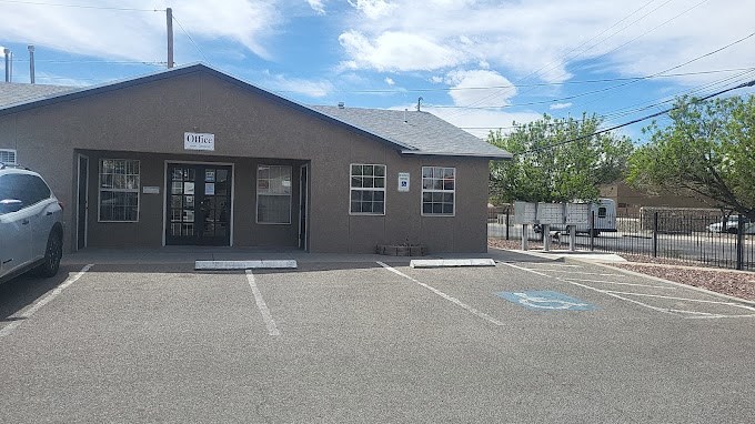 an empty parking lot in front of a building