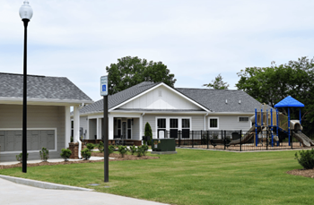 a house with a yard and a playground