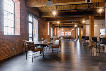 a large room with tables and chairs and a large window at The Mill at Prattville, Prattville, Alabama