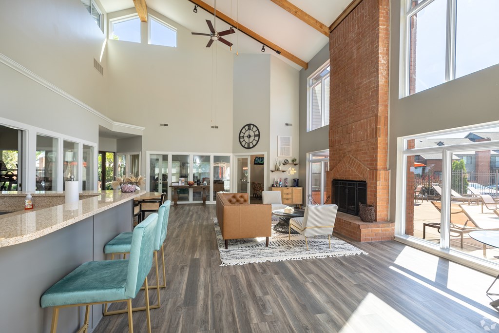 A modern open plan living area with a fireplace and a dining area.