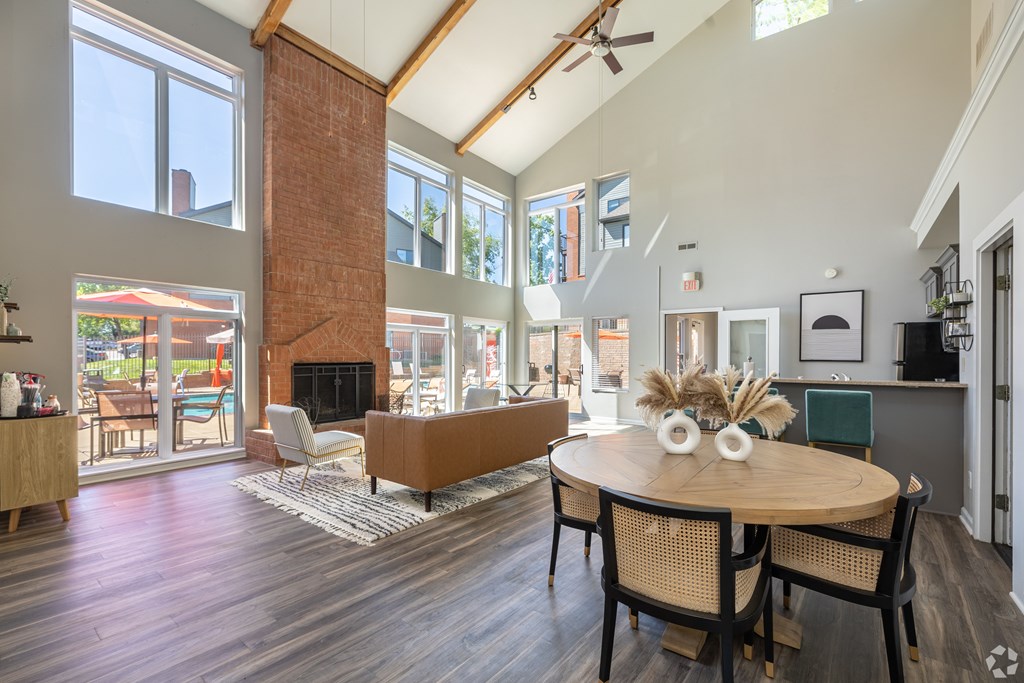 A modern dining room with a wooden table and chairs.