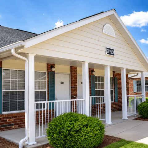 A small white building with a sign that says "OFFICE" on the front.