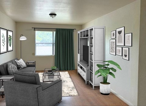 A living room with a grey couch, a white cabinet, and a green plant.