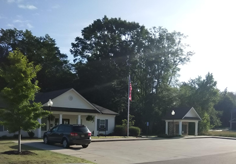 a house with a car parked in front of it