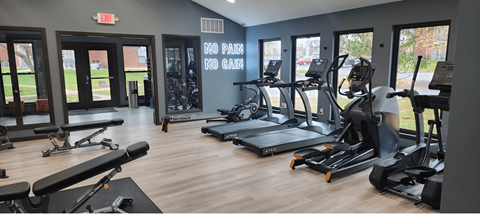 A gym with a variety of equipment including treadmills, weights, and exercise machines. at Vanderbilt Apartments, St Peters, MO, 63376