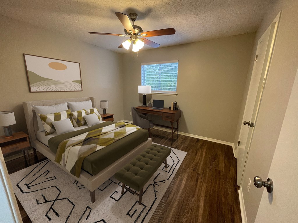 a bedroom with a large bed and a ceiling fan at The Junction, Memphis, TN, 38111