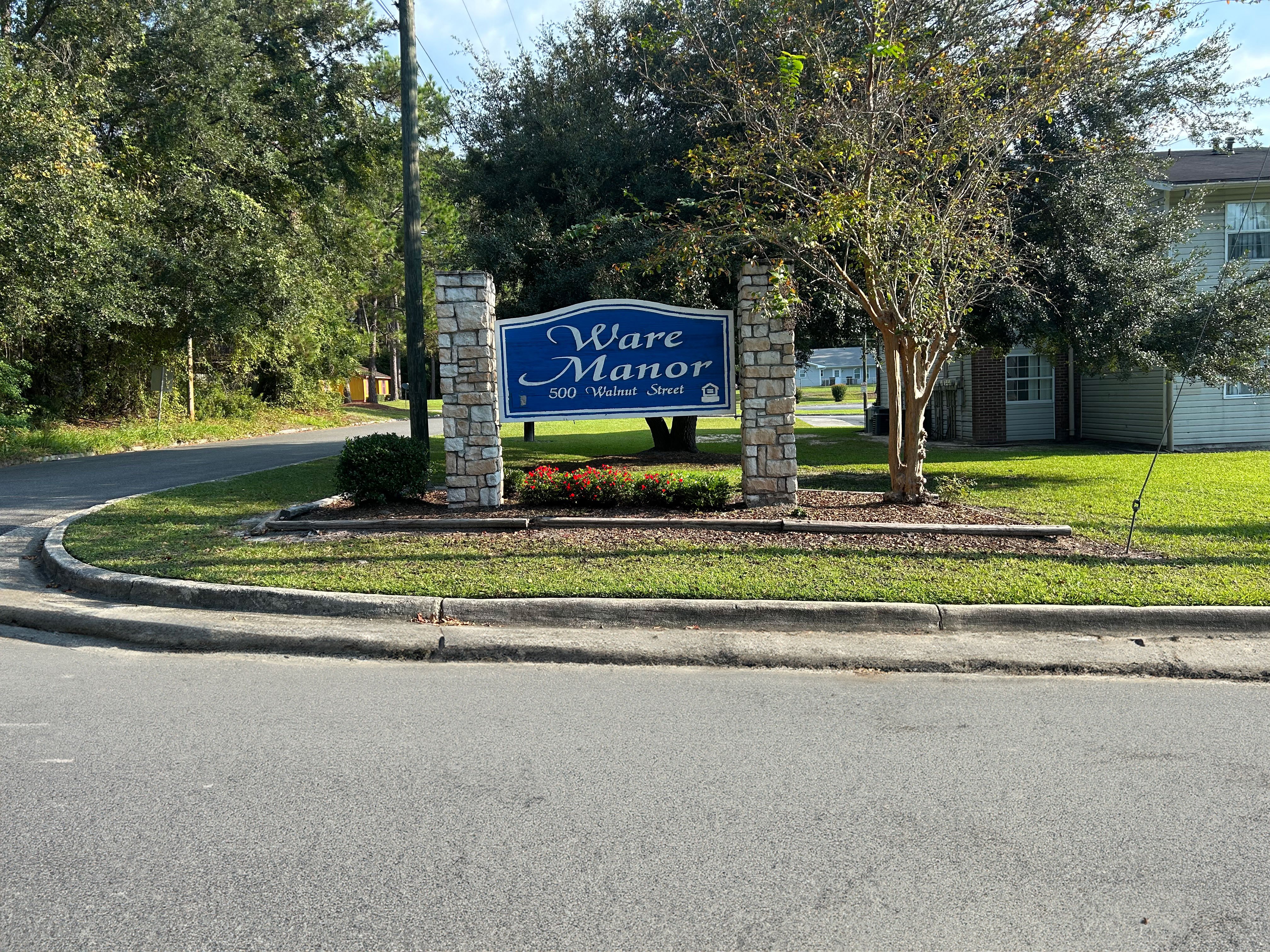 A sign for Waterfront is displayed in front of a building.