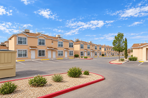 A large building with a parking lot in front of it.