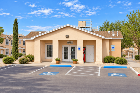 A building with a parking lot in front of it.