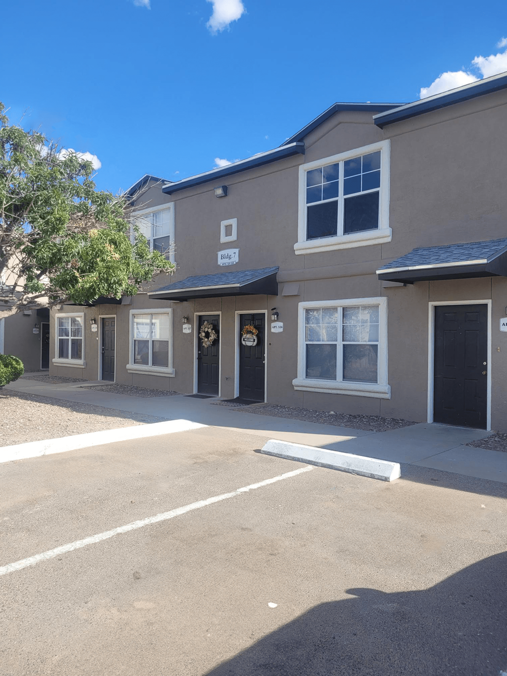 an empty parking lot in front of a building