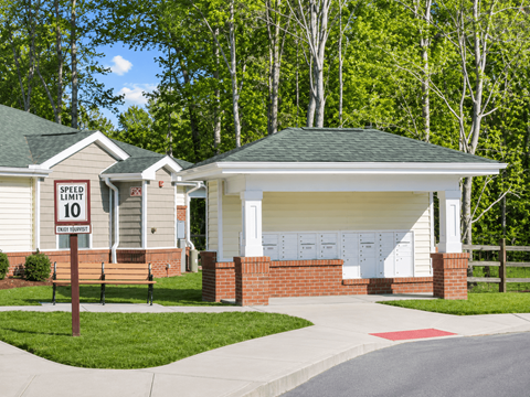 A house with a speed limit sign in front of it.