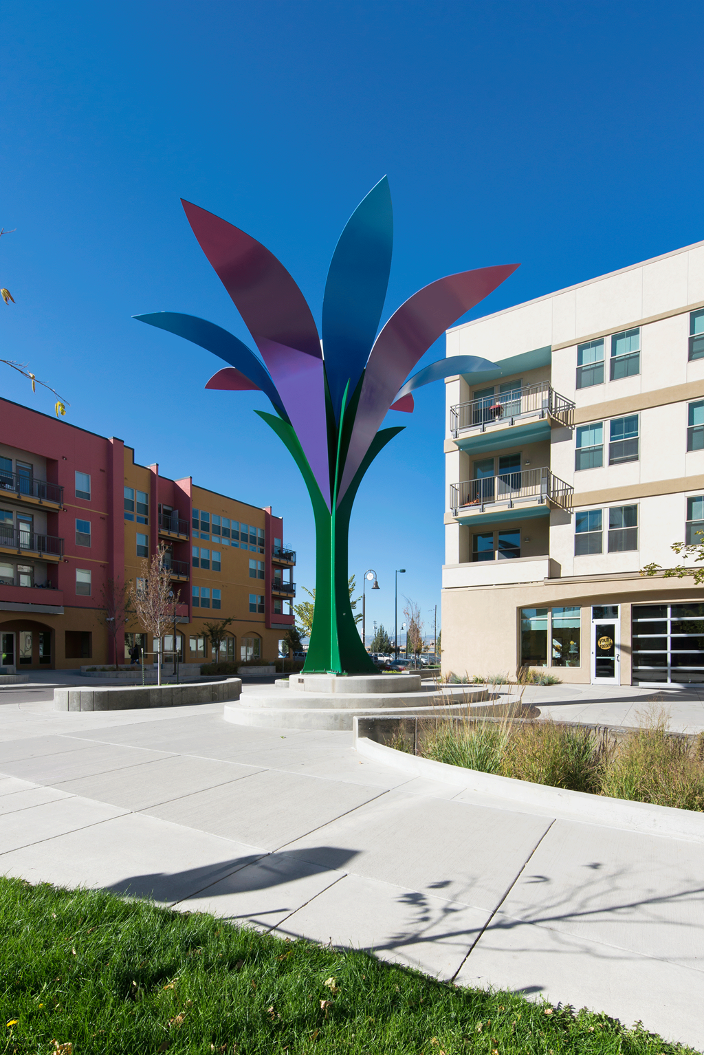 a large flower sculpture in the middle of an apartment building