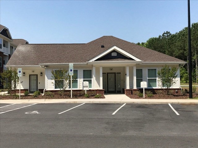 a building with a parking lot in front of it