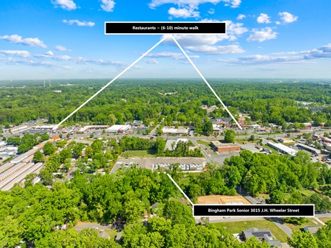 An aerial view of a town with a senior school and restaurants.