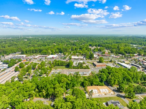 A bird's eye view of a town with buildings and trees.