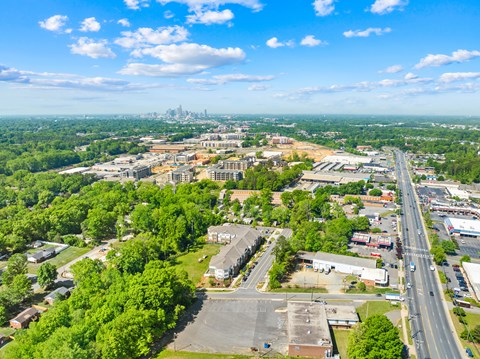A cityscape with a clear blue sky and a distant city skyline.