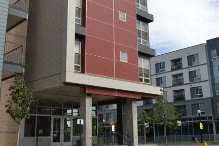 a building with a red facade on a city street