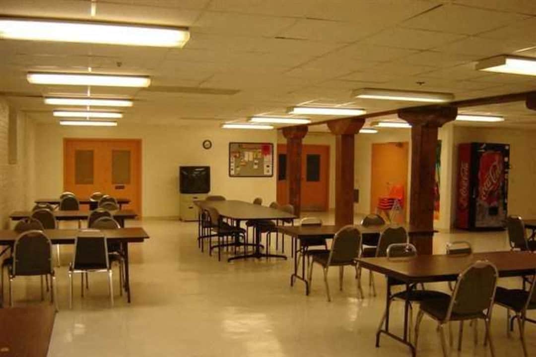 a large room filled with tables and chairs