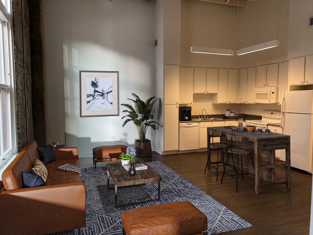 a view of a living room with a kitchen in the background at Lofts at Union Alley, Memphis