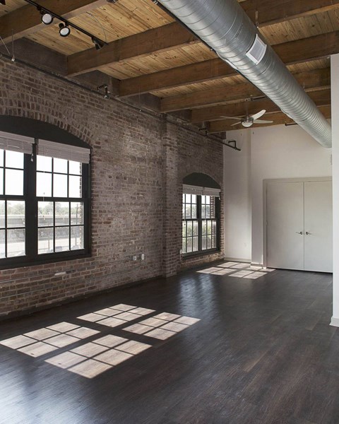 A room with a brick wall and a ceiling fan.at South Main Artspace Lofts, Memphis, TN