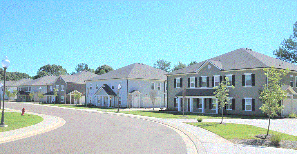 a row of houses on the side of a street