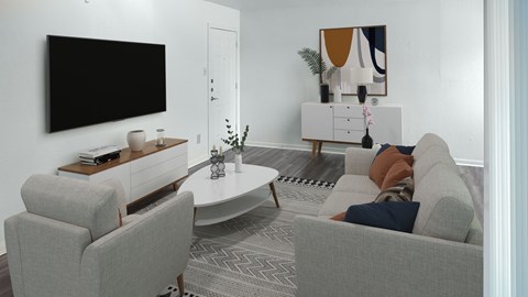 A living room with a grey sofa, a white coffee table, a black television and a painting on the wall.