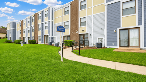 A row of apartment buildings with a sign that says "Twinbrook".