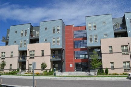 a row of colorful apartment buildings next to a street