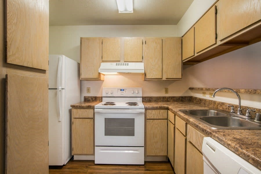Spacious kitchen with all white appliances