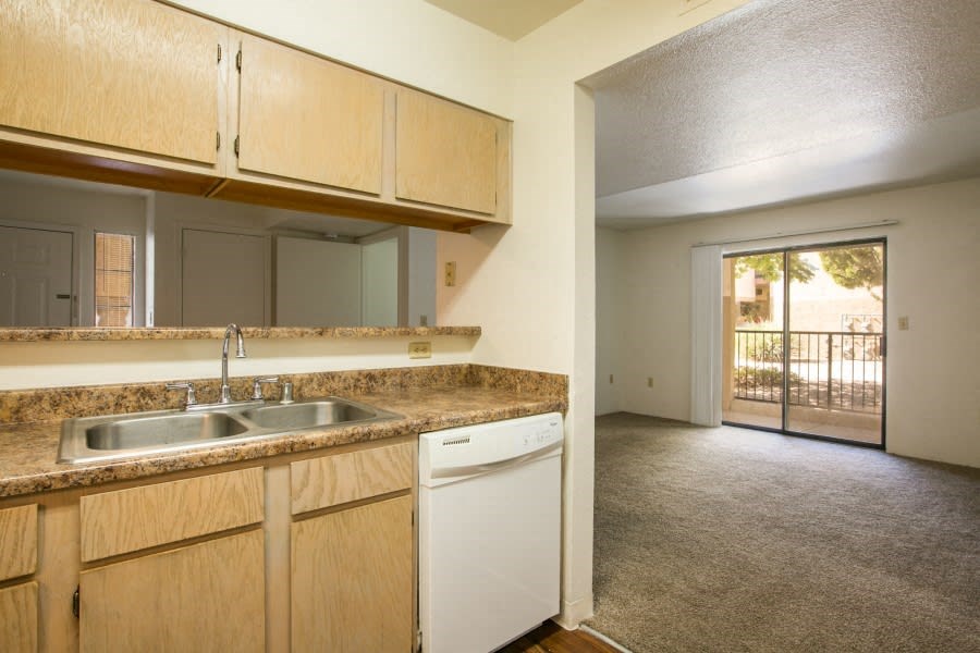 Kitchen with a dishwasher and plenty of counter space open to the living room area Kitchen with a dishwasher and plenty of counter space open to the living room area