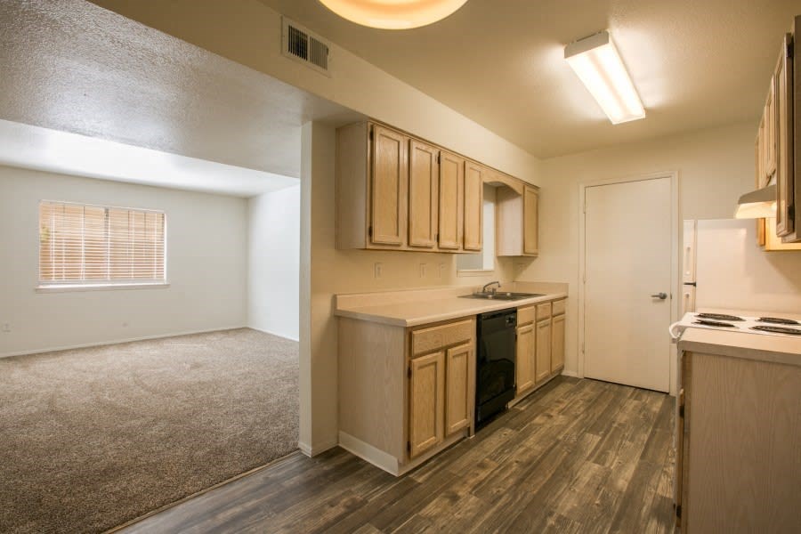 Open kitchen with rich flooring