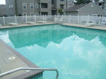 a large pool with a fence around it