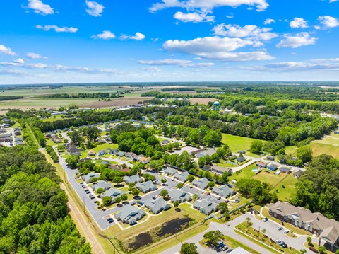 A bird's eye view of a residential area with houses and trees.