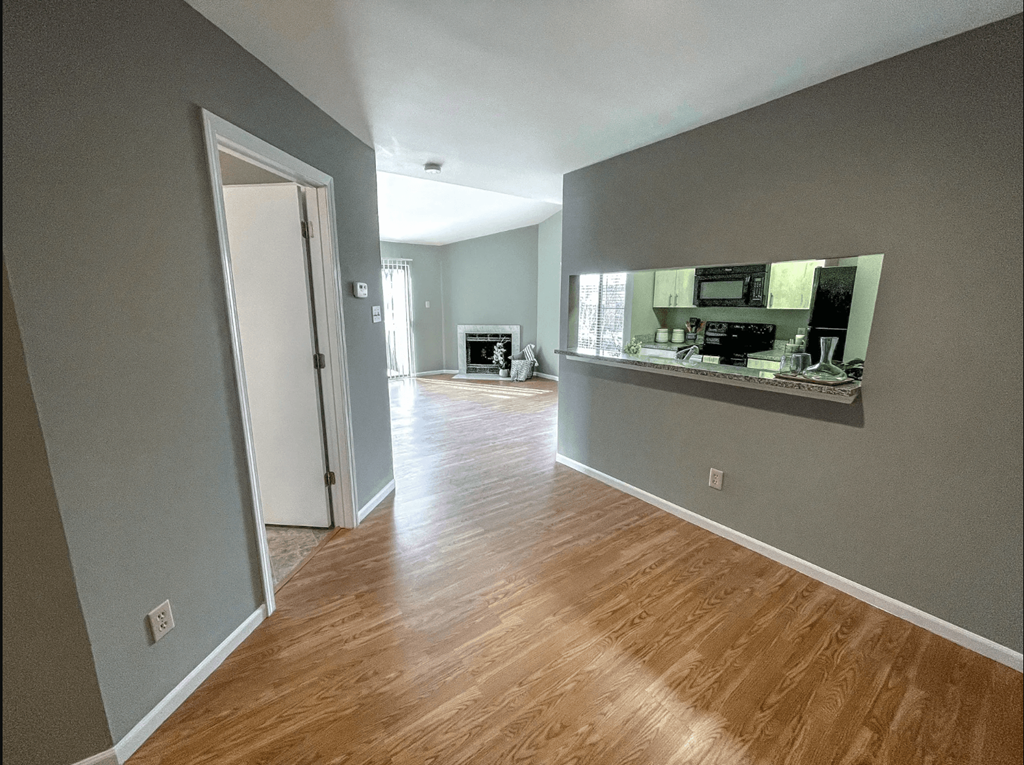 a view of the living room and kitchen from the dining room