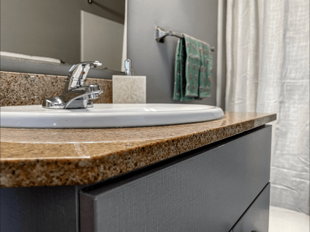 a bathroom with a sink and a mirror